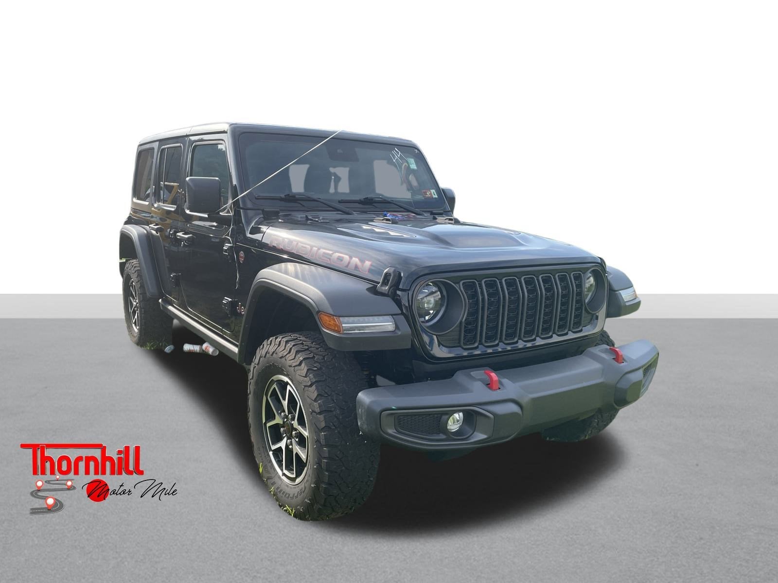 2024 Jeep Wrangler Rubicon in Black — front three-quarter view