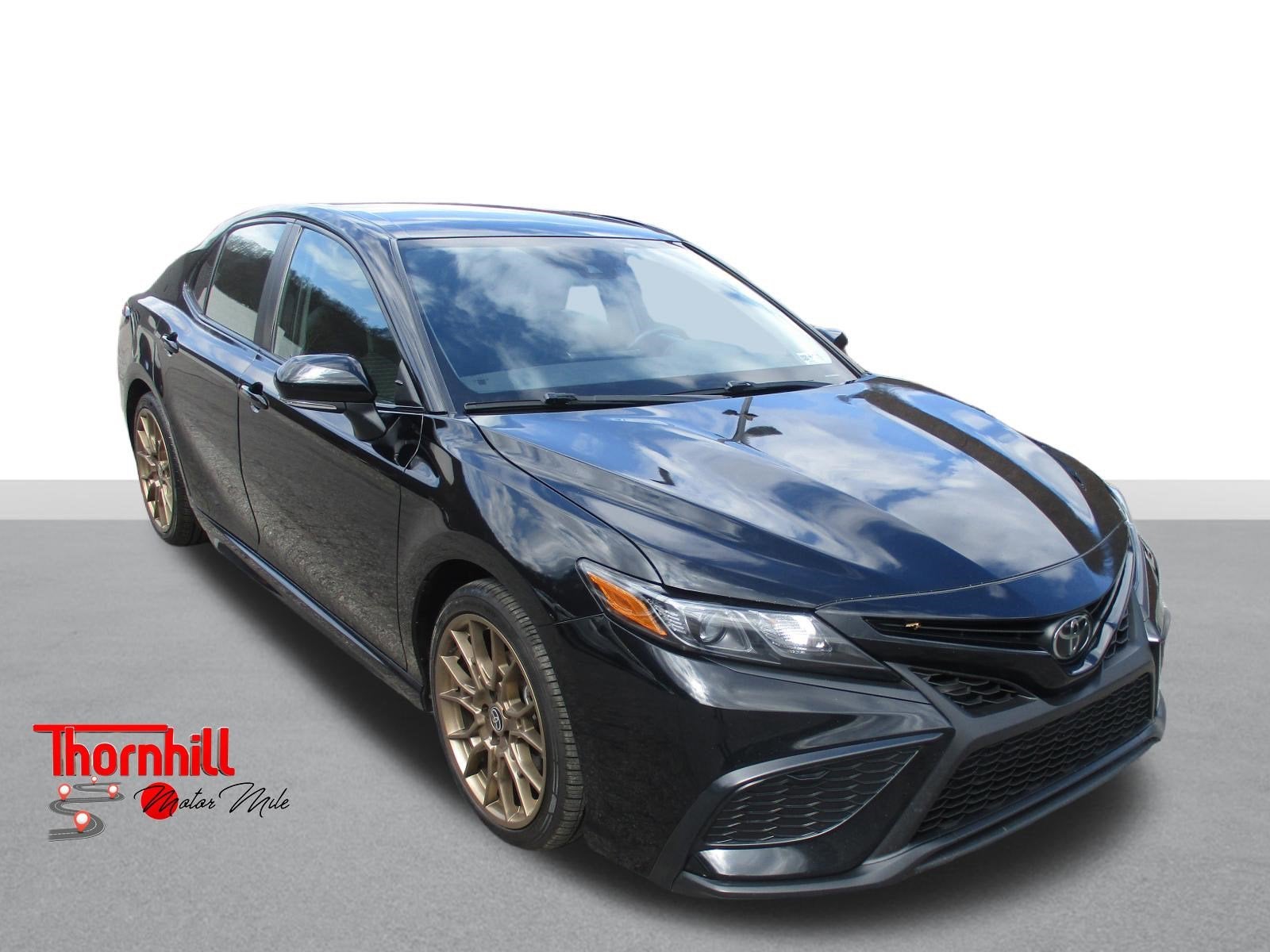 2023 Toyota Camry SE in Black — front three-quarter view