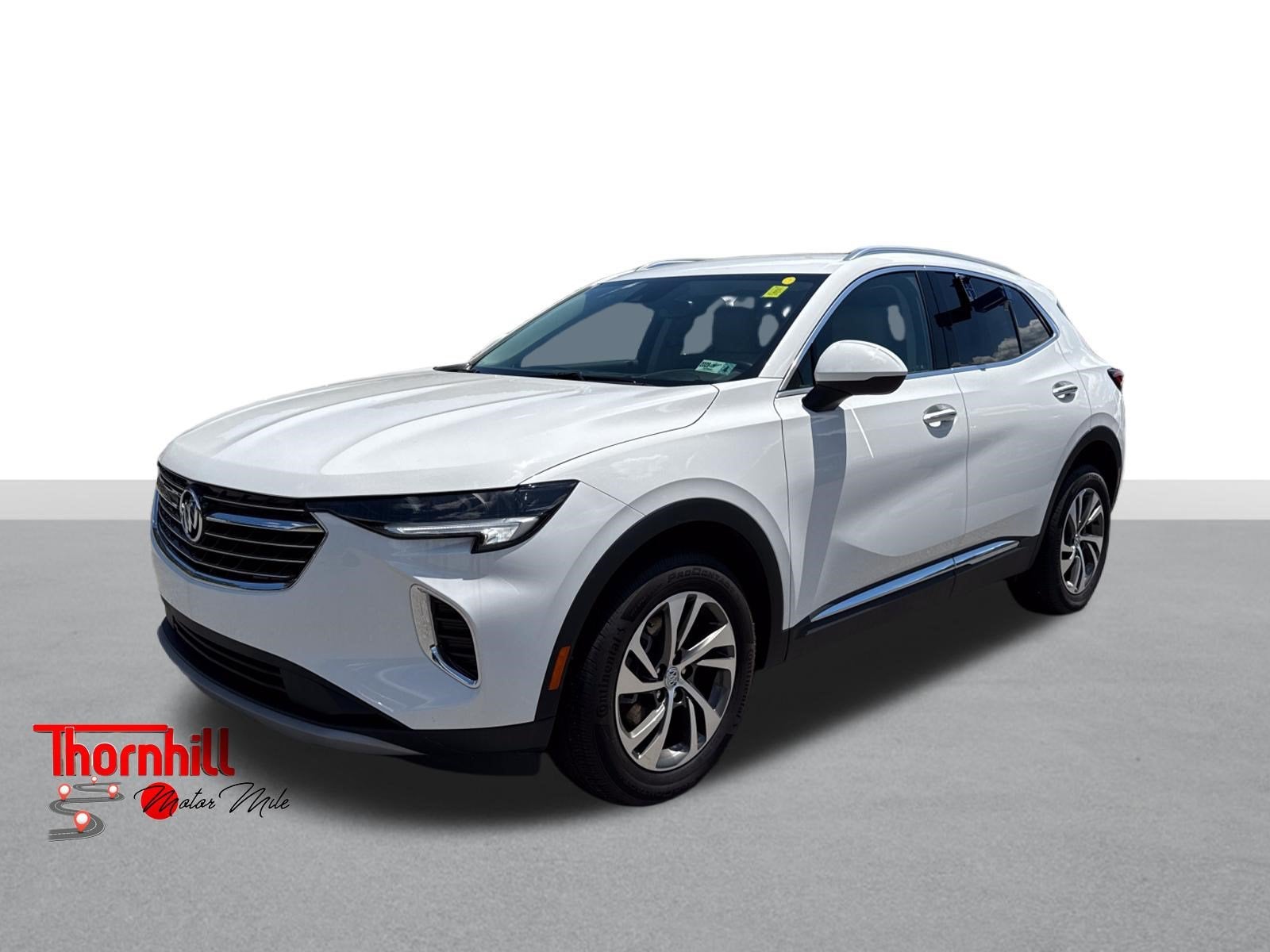 2023 Buick Envision Essence in Summit White — front three-quarter view